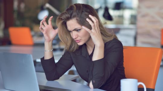frustrated woman throwing up her hands