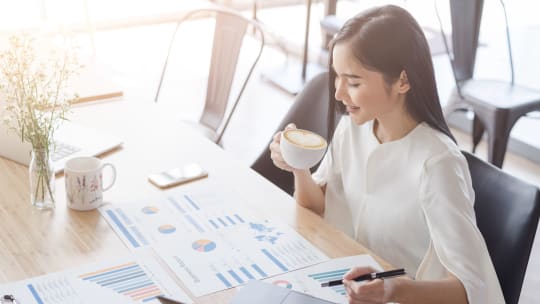 businesswoman looking at charts
