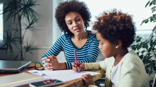 Woman working with child