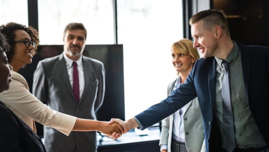 shaking hands in a meeting