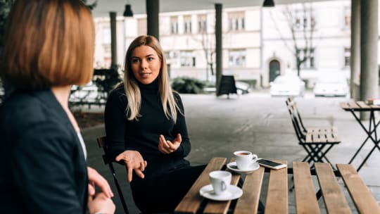 Young woman speaking to manager