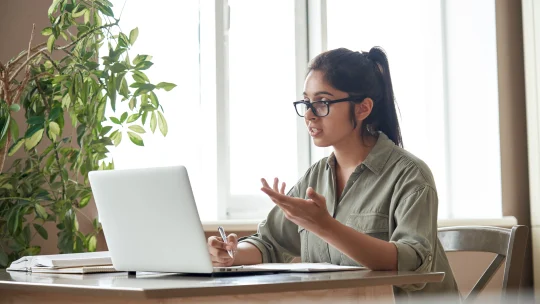 Bored woman on laptop