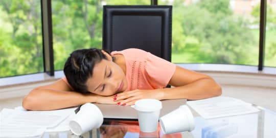 Woman asleep at desk