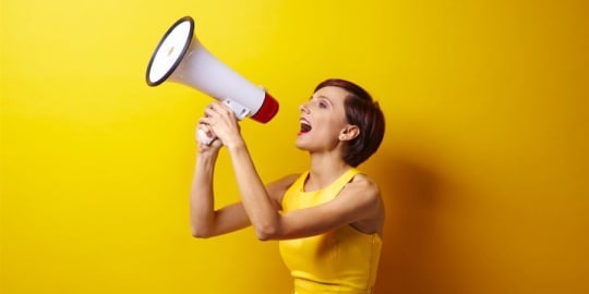 Woman using a megaphone