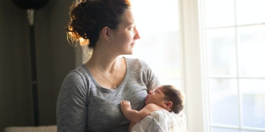 New mom holding baby