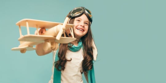 Little girl pretending to be a pilot