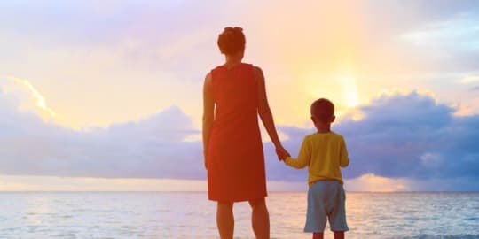 Woman and child on beach