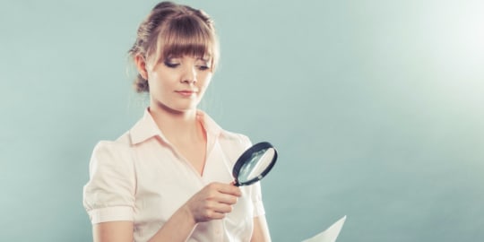 Woman with magnifying glass