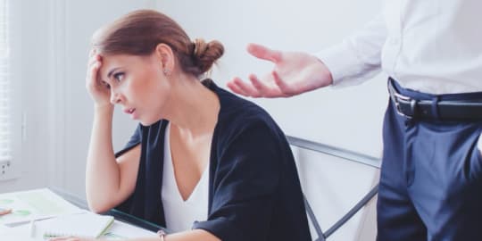 Stressed out woman with boss