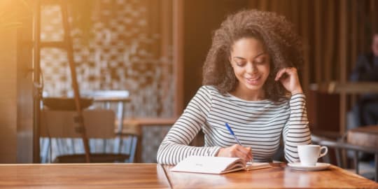 Woman writing at table