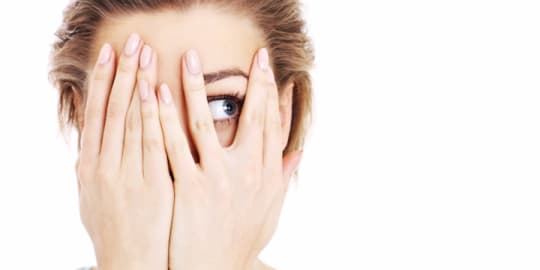 Woman hiding her face
