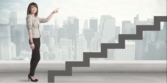 Woman pointing at staircase