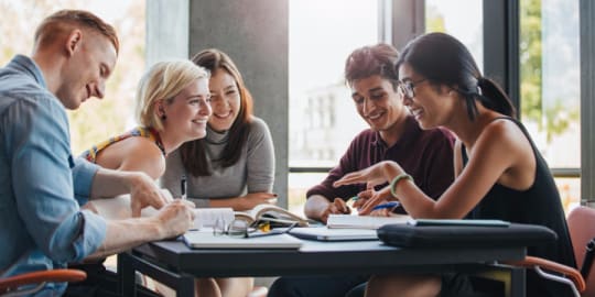 Group of people networking at table