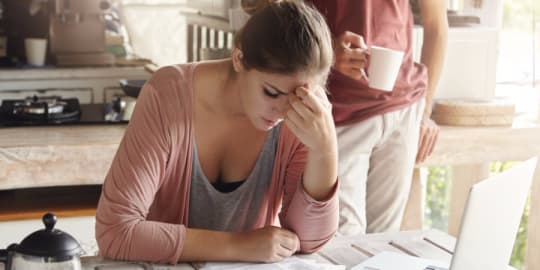 Woman stressed out at table