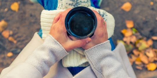 Woman holding coffee