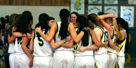 Female Basketball Team Having Team Talk