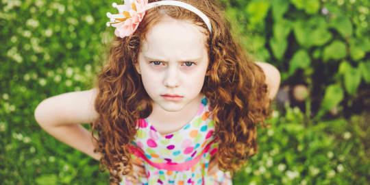 Little girl with hands up screaming