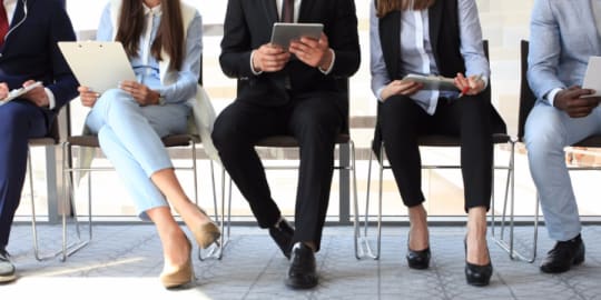 People in waiting chairs