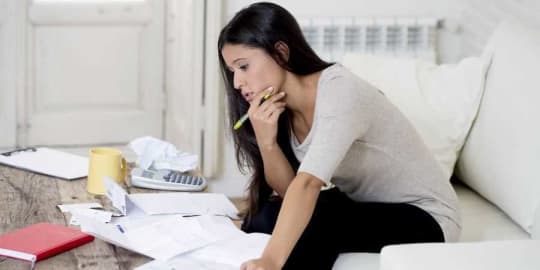woman calculating expenses