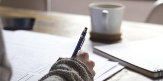 Woman revising resume