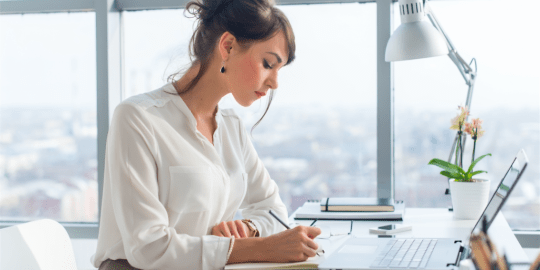 woman focusing on her computer