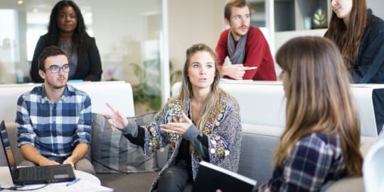 Talkative woman in a group at work