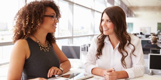 women talking at work