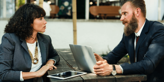 woman and man with laptop in a job interview