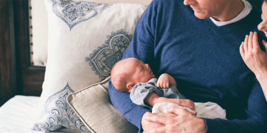 Dad holding baby