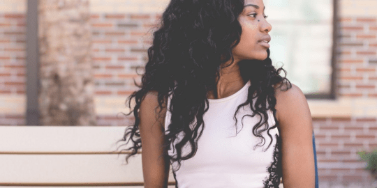 woman waiting on a bench