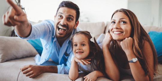 Parents Watching Movie With Daughter
