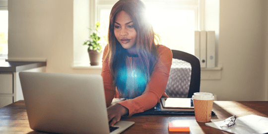 woman typing on computer