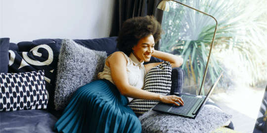 woman updating her resume on a laptop