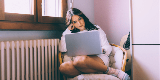 woman working on laptop at home