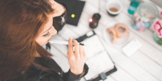 woman thinking at her desk