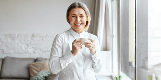 older woman smiling at work