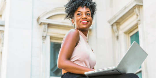 Woman smiling on laptop