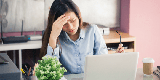 Woman with allergies at work