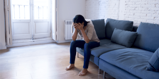 woman sitting on couch