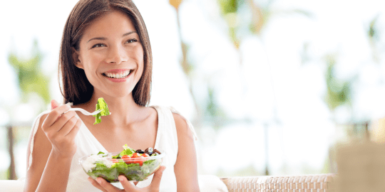 woman eating a salad