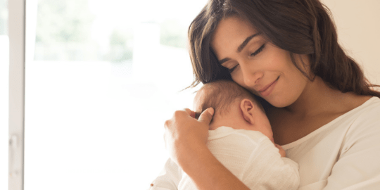 New Mom Holding Baby