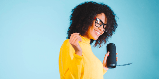 Woman holding speaker