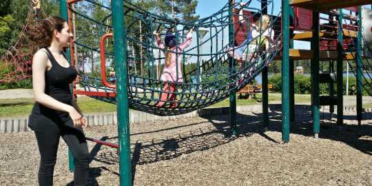 nanny with kids on playground