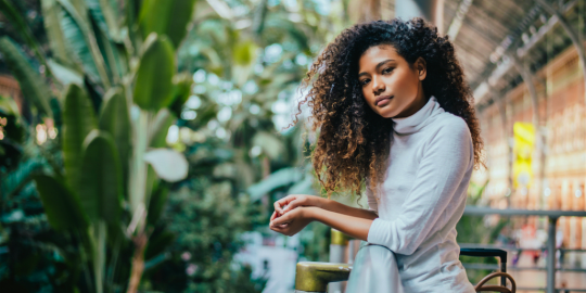 Woman of color with plants