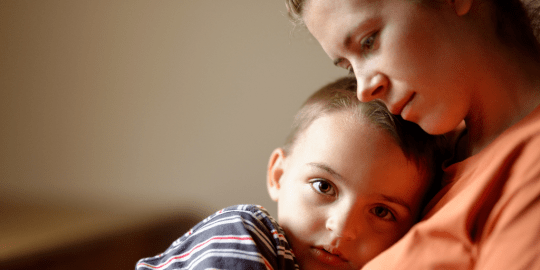 mother comforting son