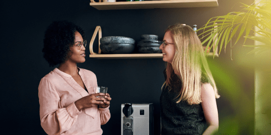 colleagues chatting by the coffee machine