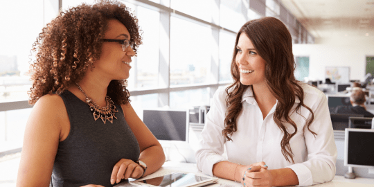 leader and coach discussing plans