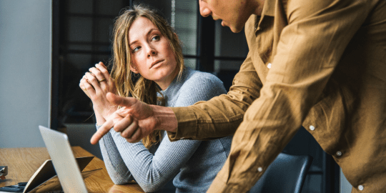 man mansplaining to a female colleague