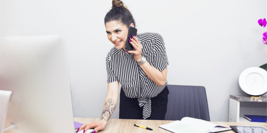 Tattooed woman in an office