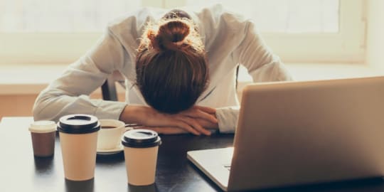 Tired woman at desk